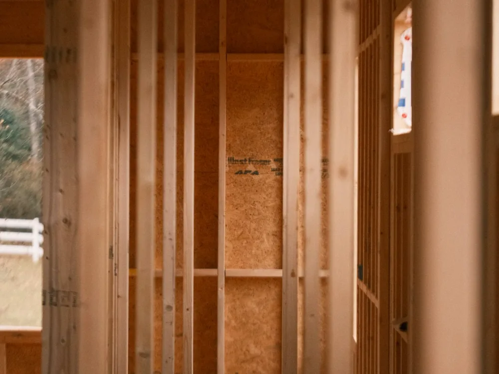 Stud walls open at first-fix stage, before the boards go on